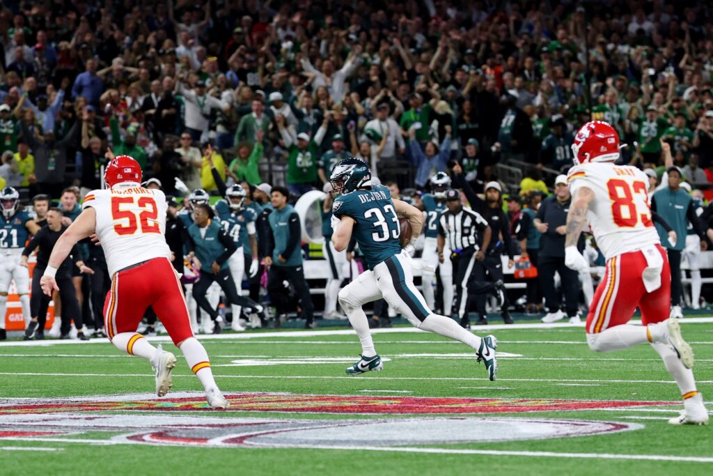 Feb 9, 2025; New Orleans, LA, USA; Philadelphia Eagles cornerback Cooper DeJean (33) runs with the ball after making an interception against the Kansas City Chiefs during the first half of Super Bowl LIX at Caesars Superdome.