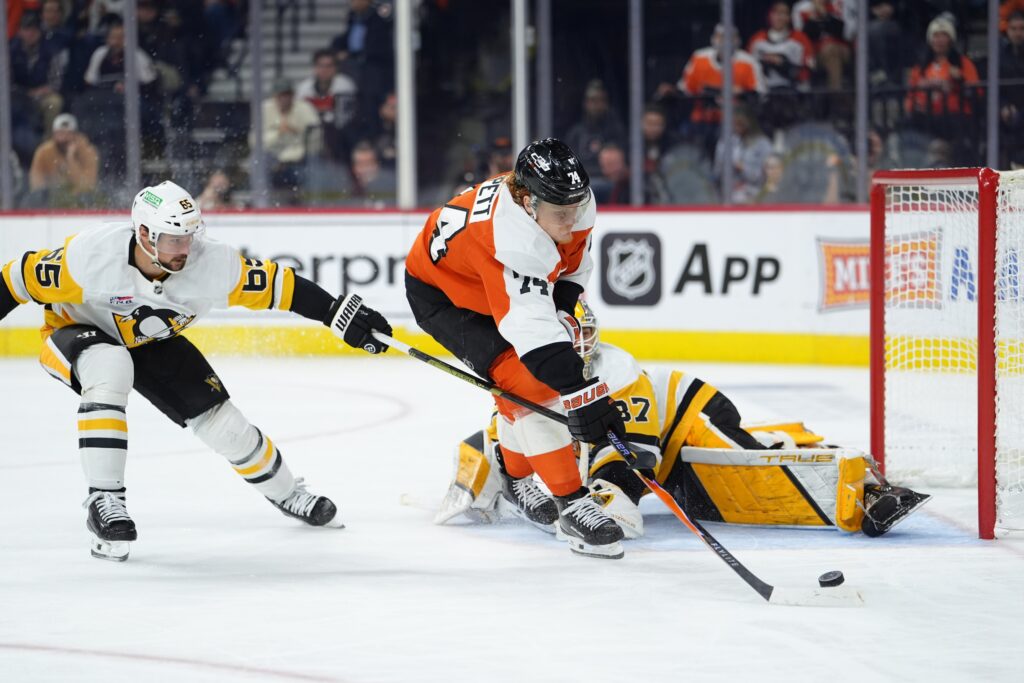 Oct 28, 2025; Philadelphia, Pennsylvania, USA; Philadelphia Flyers right wing Owen Tippett (74) attempts to shoot against Pittsburgh Penguins goalie Arturs Silovs (37) in the third period at Xfinity Mobile Arena.