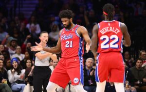 Dec 8, 2023; Philadelphia, Pennsylvania, USA; Philadelphia 76ers center Joel Embiid (21) reacts against the Atlanta Hawks in the first quarter at Wells Fargo Center.