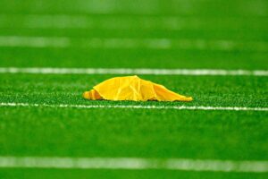 Sep 28, 2025; Arlington, Texas, USA; A view of a yellow penalty flag during the game between the Dallas Cowboys and the Green Bay Packers at AT&T Stadium.