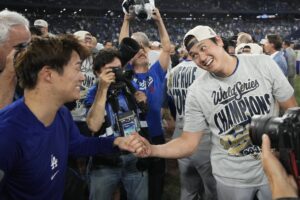 Nov 1, 2025; Toronto, Ontario, CAN; Los Angeles Dodgers two-way player Shohei Ohtani (17) celebrates with pitcher Yoshinobu Yamamoto (18) after defeating the Toronto Blue Jays during game seven of the 2025 MLB World Series at Rogers Centre.