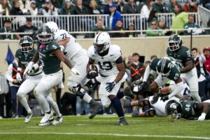 Nov 15, 2025; East Lansing, Michigan, USA; Penn State Nittany Lions running back Kaytron Allen (13) runs for a touchdown in the first quarter against the Michigan State Spartans at Spartan Stadium.