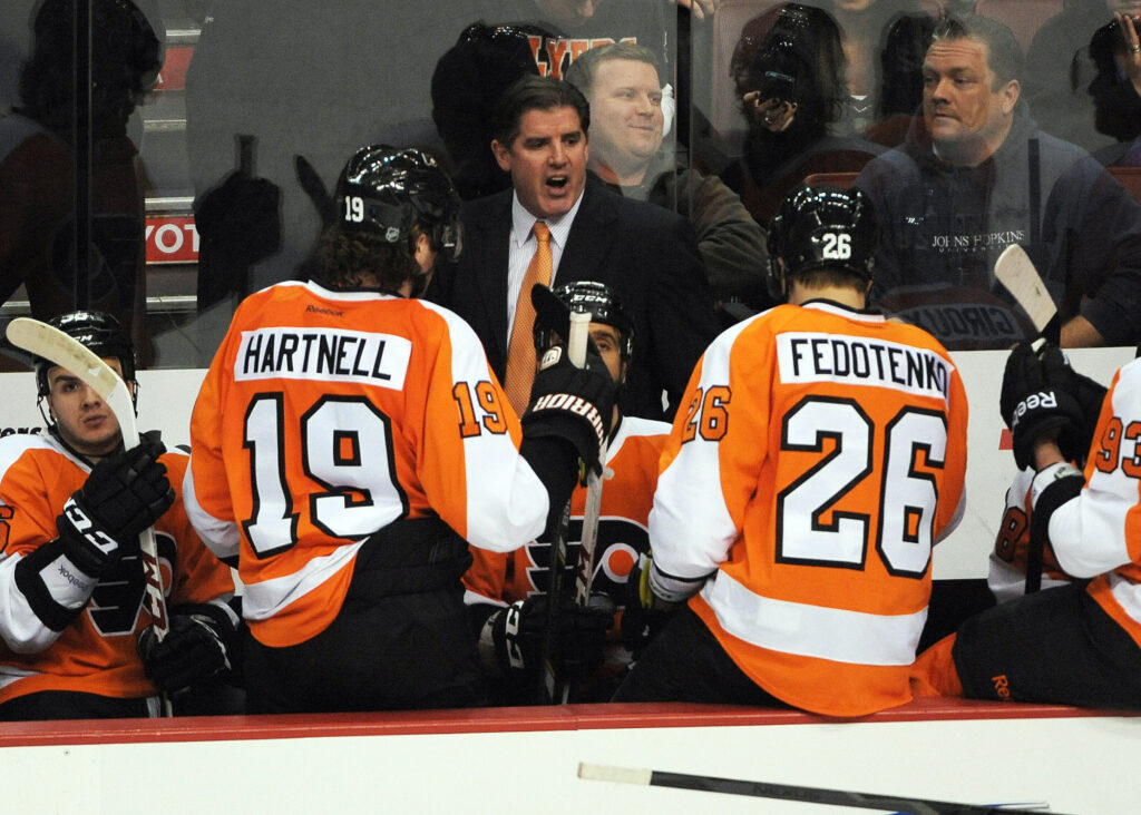 March 7, 2013; Philadelphia, PA, USA; Philadelphia Flyers head coach Peter Laviolette talks to his team during timeout against the Pittsburgh Penguins during the second period at the Wells Fargo Center.