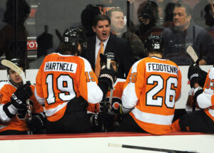 March 7, 2013; Philadelphia, PA, USA; Philadelphia Flyers head coach Peter Laviolette talks to his team during timeout against the Pittsburgh Penguins during the second period at the Wells Fargo Center.