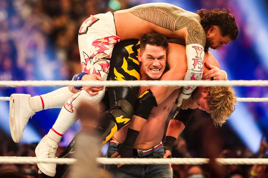 John Cena lifts Jey Iso and Logan Paul on his shoulders Saturday, Feb. 1, 2025, during the WWE Royal Rumble at Lucas Oil Stadium in Indianapolis.