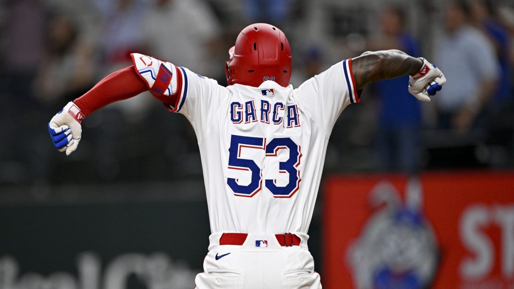 Jun 30, 2025; Arlington, Texas, USA; Texas Rangers right fielder Adolis Garcia (53) celebrates after he hits a three run home run to tie the game against the Baltimore Orioles during the tenth inning at Globe Life Field.