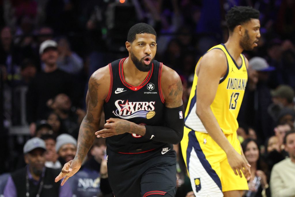 Dec 12, 2025; Philadelphia, Pennsylvania, USA; Philadelphia 76ers forward Paul George (8) reacts to his three pointer against the Indiana Pacers during the third quarter at Xfinity Mobile Arena.