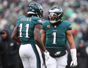 Dec 14, 2025; Philadelphia, Pennsylvania, USA; Philadelphia Eagles quarterback Jalen Hurts (1) reacts with wide receiver A.J. Brown (11) after their touchdown connection during the fourth quarter against the Las Vegas Raiders at Lincoln Financial Field.