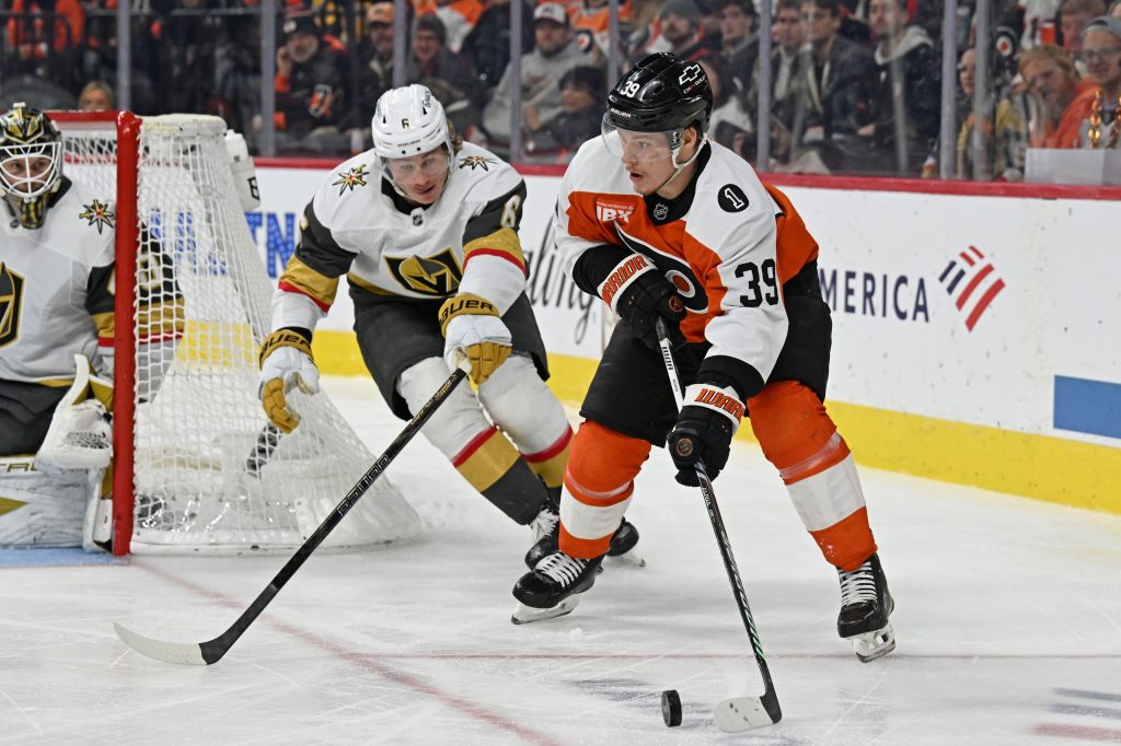 Dec 11, 2025; Philadelphia, Pennsylvania, USA; Philadelphia Flyers right wing Matvei Michkov (39) against the Vegas Golden Knights defenseman Kaedan Korczak (6) at Xfinity Mobile Arena.