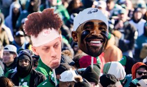 A sad Patrick Mahommes and happy Jalen Hurts appear in front of the Philadelphia Art Museum hours before a parade is expected to arrive celebrating the Philadelphia Eagles' Super Bowl win, Friday, Feb. 14, 2025.