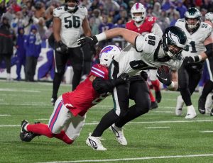 Buffalo Bills linebacker Terrel Bernard holds onto Philadelphia Eagles tight end Dallas Goedert and tackles him during first half action against the Philadelphia Eagles at Highmark Stadium in Orchard Park on Dec. 28, 2025.