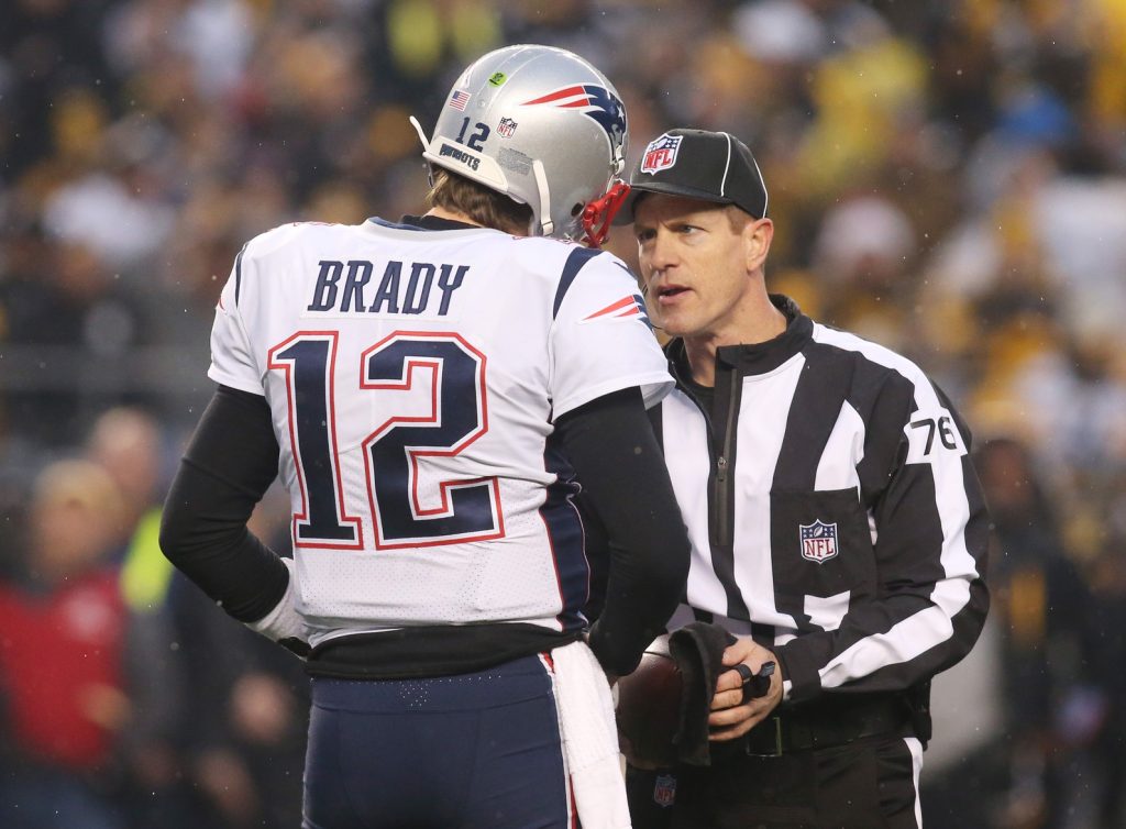 Dec 17, 2017; Pittsburgh, PA, USA; New England Patriots quarterback Tom Brady (12) talks to side judge Alan Eck (76) against the Pittsburgh Steelers during the first quarter at Heinz Field. New England won 27-24.