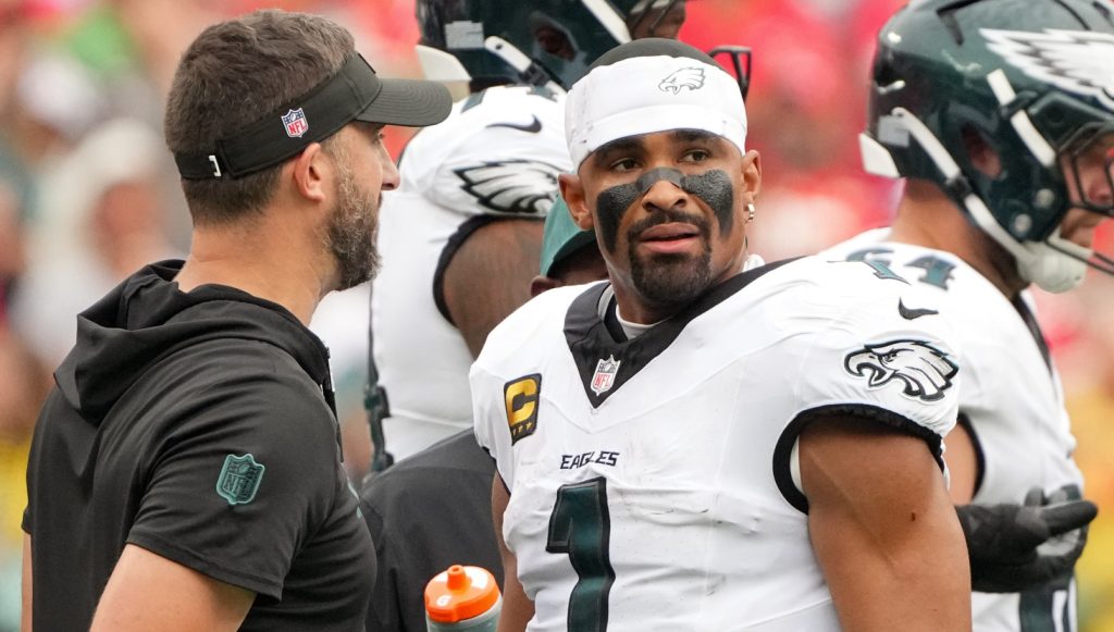 Sep 14, 2025; Kansas City, Missouri, USA; Philadelphia Eagles head coach Nick Sirianni speaks with quarterback Jalen Hurts (1) during the second quarter of the game against the Kansas City Chiefs at GEHA Field at Arrowhead Stadium.