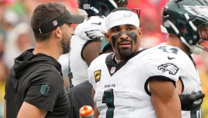 Sep 14, 2025; Kansas City, Missouri, USA; Philadelphia Eagles head coach Nick Sirianni speaks with quarterback Jalen Hurts (1) during the second quarter of the game against the Kansas City Chiefs at GEHA Field at Arrowhead Stadium.