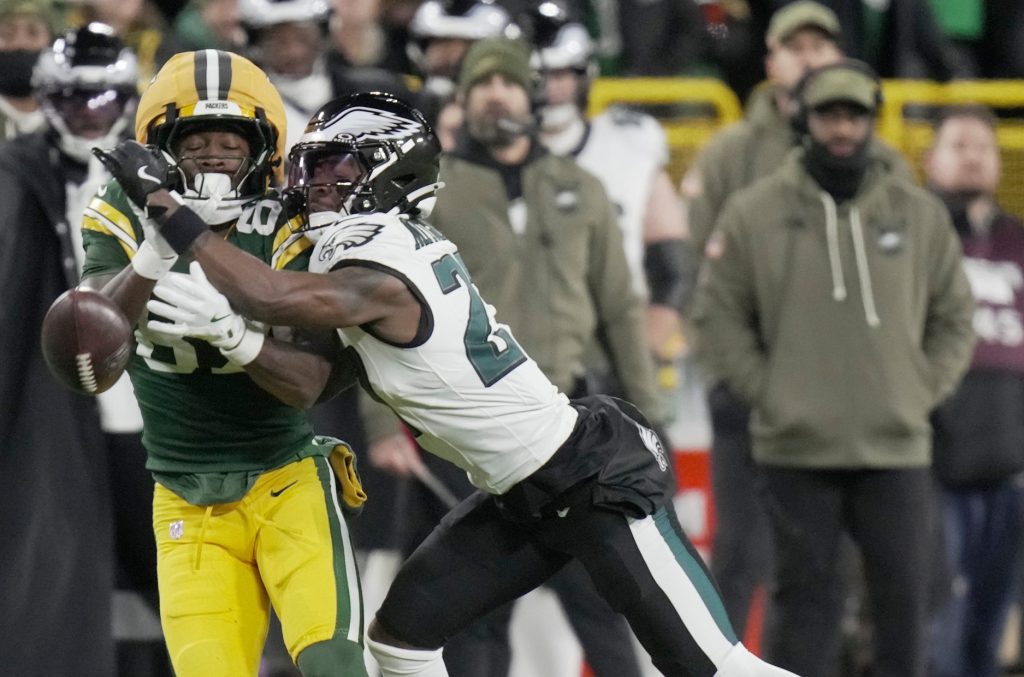 Philadelphia Eagles cornerback Quinyon Mitchell (27) breaks up a pass intended for Green Bay Packers wide receiver Romeo Doubs (87) during the second quarter of their game Monday, November 10, 2025 at Lambeau Field in Green Bay, Wisconsin.