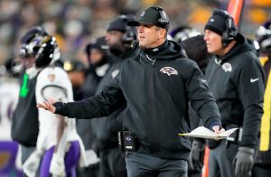 Dec 27, 2025; Green Bay, Wisconsin, USA; Baltimore Ravens head coach John Harbaugh reacts to a play during the first quarter against the Green Bay Packers at Lambeau Field.