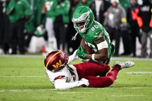 Jan 4, 2026; Philadelphia, Pennsylvania, USA; Philadelphia Eagles wide receiver Darius Cooper (80) makes a catch as Washington Commanders cornerback Jonathan Jones (31) defends during the second quarter at Lincoln Financial Field.