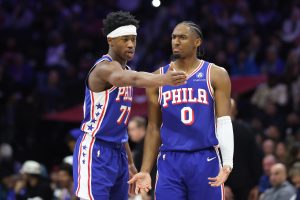 Jan 5, 2026; Philadelphia, Pennsylvania, USA; Philadelphia 76ers guard Vj Edgecombe (77) and guard Tyrese Maxey (0) talk during the third quarter against the Denver Nuggets at Xfinity Mobile Arena.