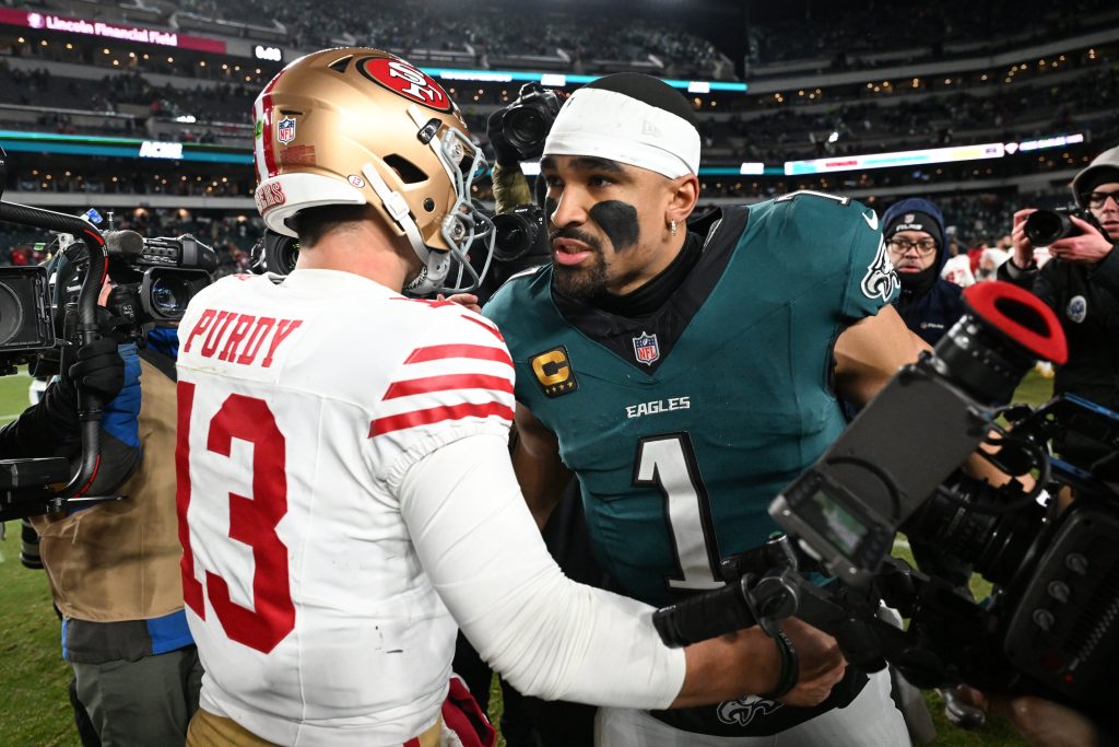 Jan 11, 2026; Philadelphia, PA, USA; San Francisco 49ers quarterback Brock Purdy (13) speaks with Philadelphia Eagles quarterback Jalen Hurts (1) after an NFC Wild Card Round game at Lincoln Financial Field.