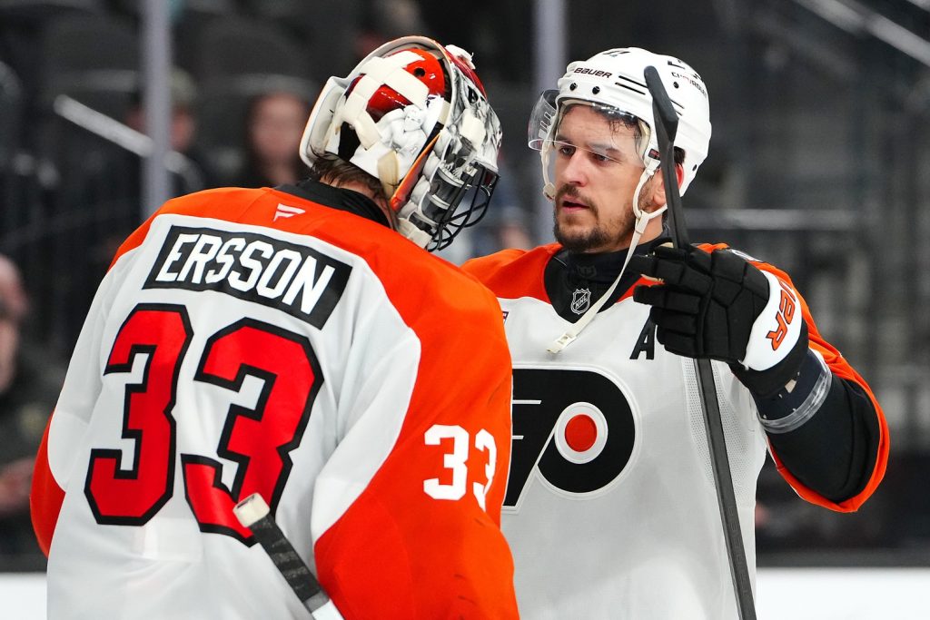 Jan 19, 2026; Las Vegas, Nevada, USA; Philadelphia Flyers right wing Travis Konecny (11) congratulates Philadelphia Flyers goaltender Samuel Ersson (33) after the Flyers defeated the Vegas Golden Knights 2-1 at T-Mobile Arena.