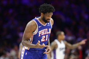 Jan 29, 2026; Philadelphia, Pennsylvania, USA; Philadelphia 76ers center Joel Embiid (21) reacts to his three pointer against the Sacramento Kings during the second quarter at Xfinity Mobile Arena. Mandatory Credit:
