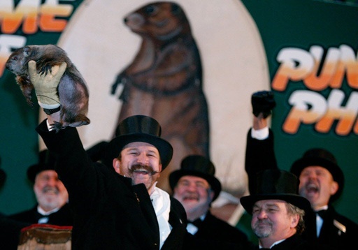 Groundhog handler Ben Hughes holds up Punxsutawney Phil. Phil did not see his shadow predicting an early spring during festivities Feb. 2, 2007.