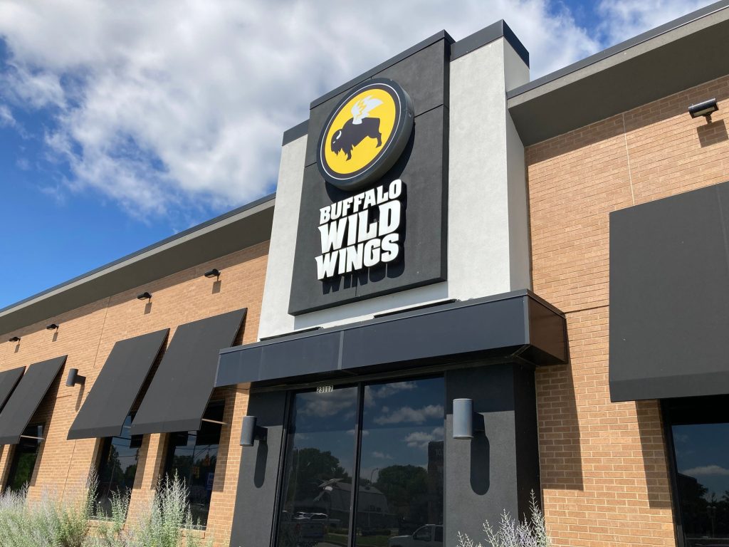 The outside of a Buffalo Wild Wings restaurant on Harper Avenue in St. Clair Shores on Saturday June 28, 2025. The restaurant has a Bitcoin Depot ATM inside.