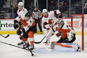 Feb 5, 2026; Philadelphia, Pennsylvania, USA; Philadelphia Flyers defenseman Nick Seeler (24) clears the puck in front of goaltender Dan Vladar (80) against the Ottawa Senators during the second period at Xfinity Mobile Arena.