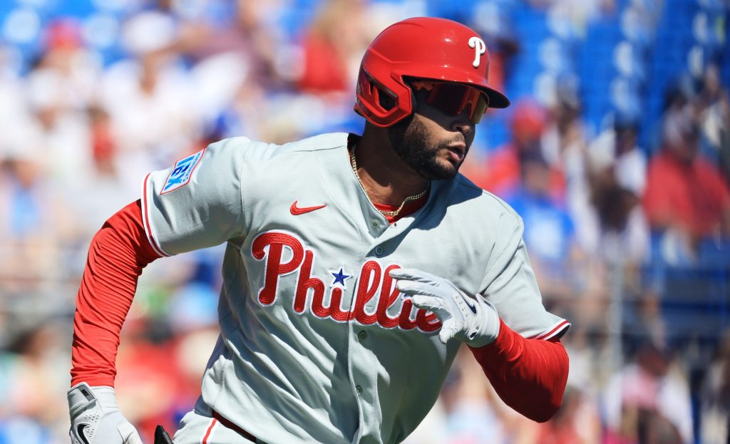 Feb 21, 2026; Dunedin, Florida, USA; Philadelphia Phillies outfielder Justin Crawford (80) doubles during the first inning against the Toronto Blue Jays at TD Ballpark.