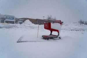 Plows clear the parking lot of an Ocean Township plaza after a storm dumps over a foot of snow throughout much of the state. Monday, February 23, 2026.