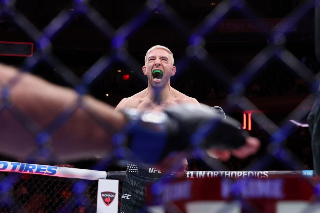 Nov 15, 2025; New York, NY, UNITED STATES; Kyle Daukaus (red gloves) reacts after defeating Gerald Meerschaert (blue gloves) in the middleweight bout during UFC 322 at Madison Square Garden.