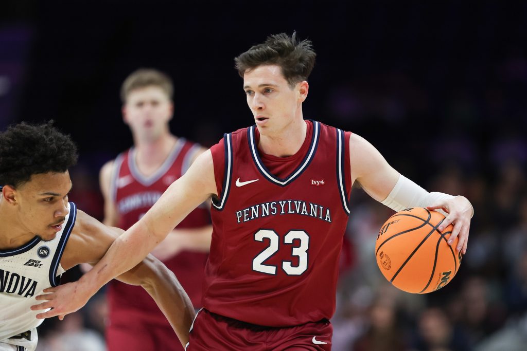 Dec 6, 2025; Philadelphia, PA, USA; Penn Quakers forward Ethan Roberts (23) dribbles the ball against the Villanova Wildcats during the first half at Xfinity Mobile Arena.
