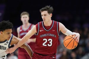 Dec 6, 2025; Philadelphia, PA, USA; Penn Quakers forward Ethan Roberts (23) dribbles the ball against the Villanova Wildcats during the first half at Xfinity Mobile Arena.