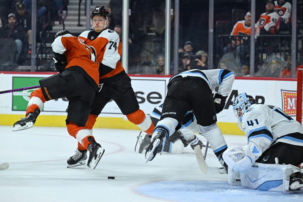 Mar 5, 2026; Philadelphia, Pennsylvania, USA; Philadelphia Flyers right wing Garnet Hathaway (19) and Philadelphia Flyers right wing Owen Tippett (74) collide in front of Utah Mammoth goaltender Vitek Vanecek (41) during the third period at Xfinity Mobile Arena.