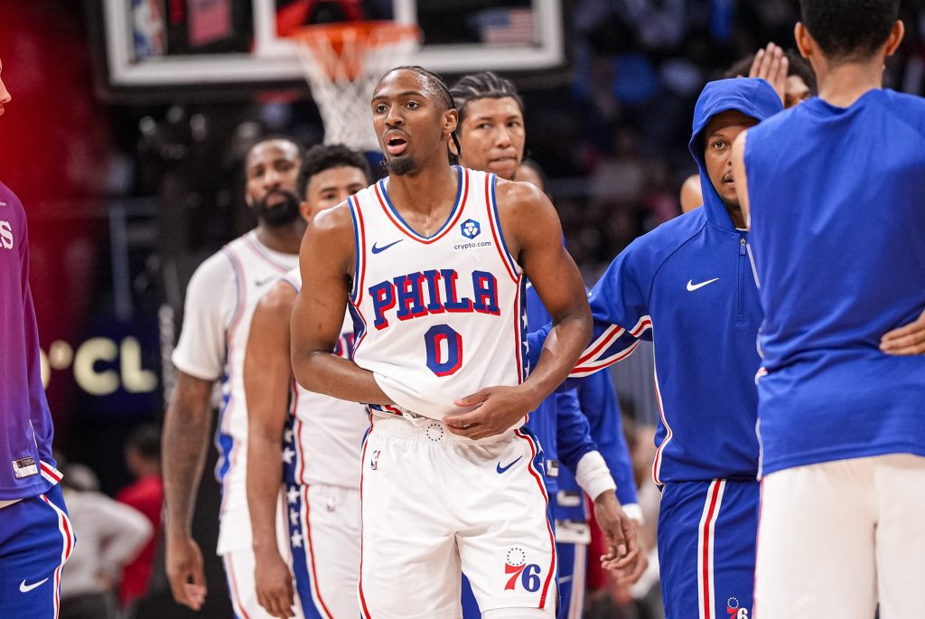 Mar 7, 2026; Atlanta, Georgia, USA; Philadelphia 76ers guard Tyrese Maxey (0) reacts and is assisted after being injured against the Atlanta Hawks during the second half at State Farm Arena.