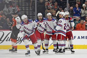 Mar 9, 2026; Philadelphia, Pennsylvania, USA; New York Rangers left wing Alexis Lafrenire (13) skates back to the bench after scoring a goal against the Philadelphia Flyers during the first period at Xfinity Mobile Arena.
