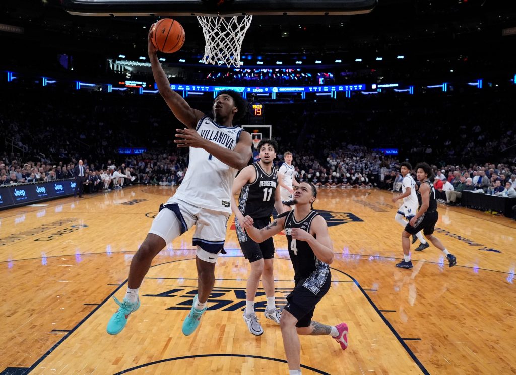 Mar 12, 2026; New York, NY, USA; Villanova Wildcats guard Malachi Palmer (7) drives past Georgetown Hoyas forward Caleb Williams (4) during the first half at Madison Square Garden.