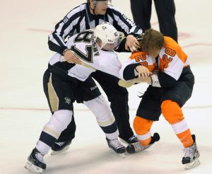 April 15, 2012; Philadelphia, PA, USA; Philadelphia Flyers center Claude Giroux (28) and Pittsburgh Penguins center Sidney Crosby (87) fight during the first period in game three of the 2012 Eastern Conference quarterfinals at Wells Fargo Arena. Mandatory Credit: