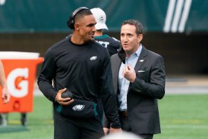 Dec 13, 2020; Philadelphia, Pennsylvania, USA; Philadelphia Eagles quarterback Jalen Hurts (L) talks with general manager Howie Roseman (R) before a game against the New Orleans Saints at Lincoln Financial Field.