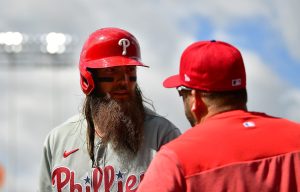 May 3, 2023; Los Angeles, California, USA; Philadelphia Phillies center fielder Brandon Marsh (16) speaks with hitting coach Kevin Long (53) before hitting against the Los Angeles Dodgers. during the eighth inning at Dodger Stadium.