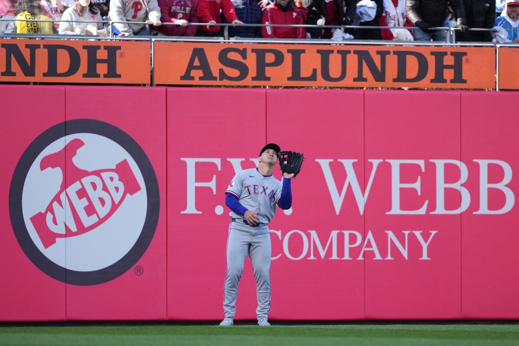 Mar 28, 2026; Philadelphia, Pennsylvania, USA; Texas Rangers outfielder Wyatt Langford (36) fields a fly ball against the Philadelphia Phillies in the third inning at Citizens Bank Park.
