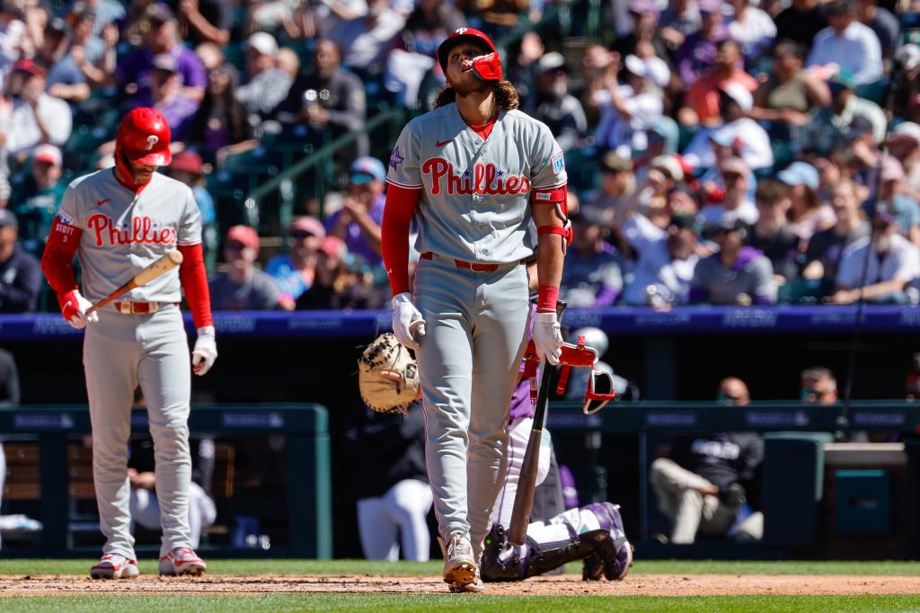 Apr 5, 2026; Denver, Colorado, USA; Philadelphia Phillies third baseman Alec Bohm (28) reacts to an ABS call in the fourth inning against the Colorado Rockies at Coors Field.