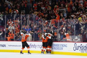 Apr 5, 2026; Philadelphia, Pennsylvania, USA; Philadelphia Flyers right wing Porter Martone (94) celebrates with teammates after scoring a goal against the Boston Bruins in overtime at Xfinity Mobile Arena.