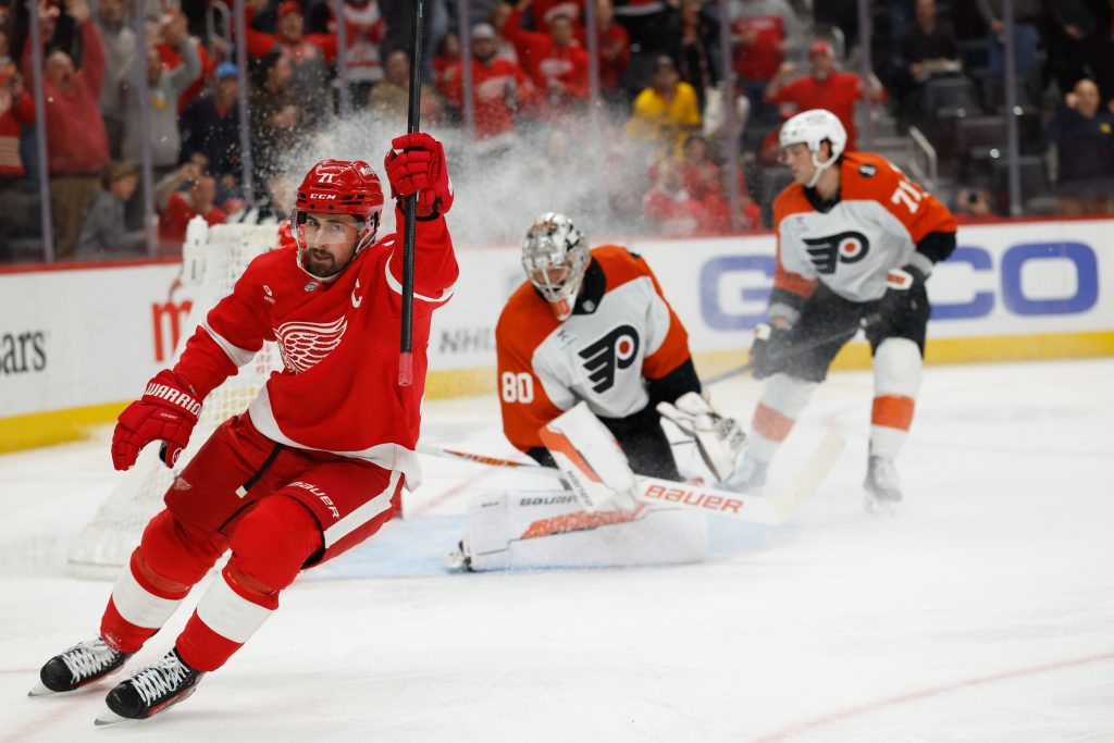 Mar 28, 2026; Detroit, Michigan, USA; Detroit Red Wings center Dylan Larkin (71) celebrates after scoring on Philadelphia Flyers goaltender Dan Vladar (80) in the second period at Little Caesars Arena.