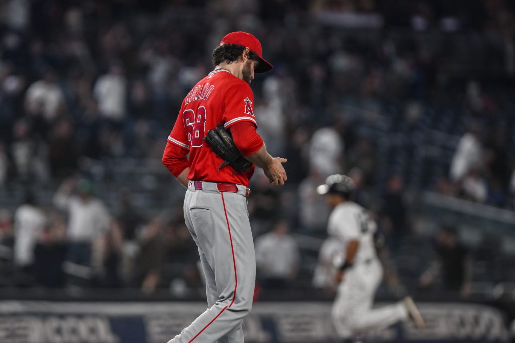 Apr 13, 2026; Bronx, New York, USA; Los Angeles Angels pitcher Jordan Romano (68) reacts after giving up a two run home run to New York Yankees center fielder Trent Grisham (not pictured) during the ninth inning at Yankee Stadium.