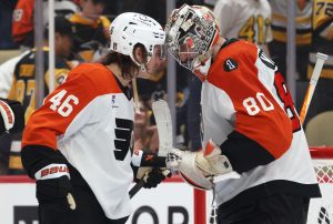 Apr 18, 2026; Pittsburgh, Pennsylvania, USA; Philadelphia Flyers center Trevor Zegras (46) and goaltender Dan Vladar (80) celebrate after defeating the Pittsburgh Penguins in game one of the first round of the 2026 Stanley Cup Playoffs at PPG Paints Arena.