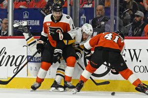 Apr 22, 2026; Philadelphia, Pennsylvania, USA; Pittsburgh Penguins right wing Justin Brazeau (16) battles for the puck with Philadelphia Flyers right wing Garnet Hathaway (19) and center Luke Glendening (41) during the first period in game three of the first round of the 2026 Stanley Cup Playoffs at Xfinity Mobile Arena.