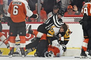 Apr 22, 2026; Philadelphia, Pennsylvania, USA; Pittsburgh Penguins right wing Bryan Rust (17) wrestles with Philadelphia Flyers right wing Travis Konecny (11) during the second period in game three of the first round of the 2026 Stanley Cup Playoffs at Xfinity Mobile Arena.
