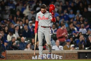 Apr 22, 2026; Chicago, Illinois, USA; Philadelphia Phillies shortstop Trea Turner (7) reacts after striking out against the Chicago Cubs during the seventh inning at Wrigley Field.
