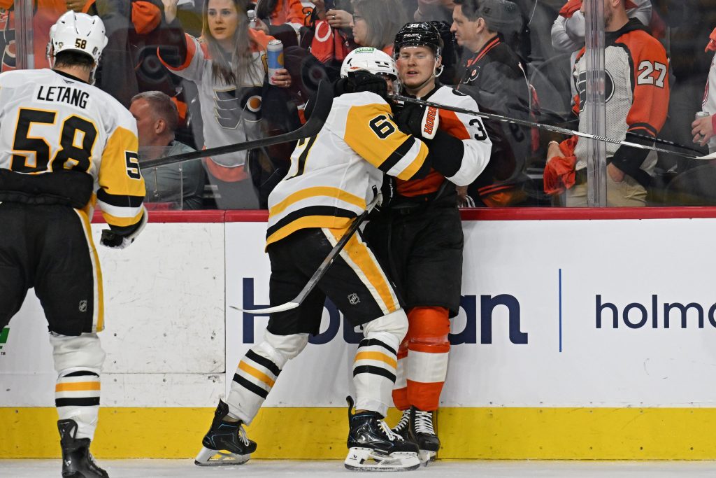 Apr 25, 2026; Philadelphia, Pennsylvania, USA; Pittsburgh Penguins right wing Rickard Rakell (67) and Philadelphia Flyers right wing Matvei Michkov (39) battle after the game in game four of the first round of the 2026 Stanley Cup Playoffs at Xfinity Mobile Arena.